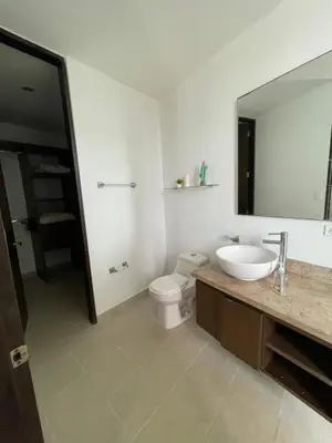 a bathroom with a sink and a toilet and a mirror at Acogedor apartamento con vista al mar en coveñas in Coveñas