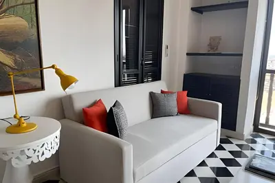 a living room with a white couch and a table at 704 Puesta de sol apto en Cartagena in Cartagena de Indias
