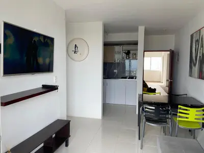 a kitchen and dining room with a table and yellow chairs at Taller del artista II in Cartagena de Indias