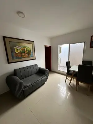 a living room with a couch and a table at APARTAMENTO in Cartagena de Indias
