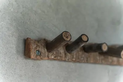a group of three wooden knobs on a wall at CasaCoral Hotel in Isla Fuerte
