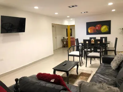 a living room with a couch and a table at Martinica Hostel in Cartagena de Indias