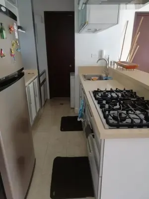 a kitchen with a stove top oven in a kitchen at APARTAMENTO MORROS922 LA BOQUILLA con acceso directo a la Playa in Cartagena de Indias