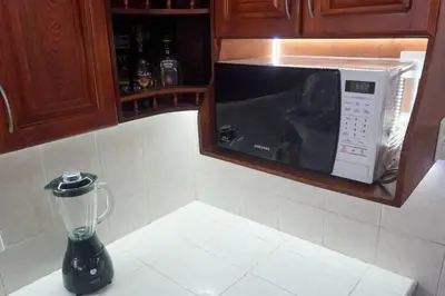 a blender sitting on a counter next to a microwave at Azul de Bocagrande in Cartagena de Indias