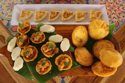 a plate of food with appetizers on a table at VAIA HOTELES in Coveñas