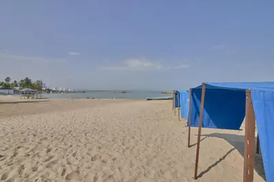 a row of blue nets on a sandy beach at Magico Apartamento Frente al Mar 3 Habitaciones PAZ224 in Coveñitas