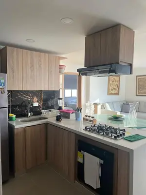 a kitchen with a sink and a stove top oven at Apartamento con vista al mar in Cartagena de Indias