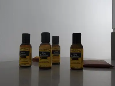 four bottles of mustard sitting on a table at Loft Distrito 90 in Barranquilla