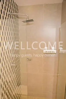 a shower with a sign that says liveonne happy owners at Loft Distrito 90 in Barranquilla