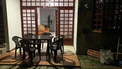 a table and chairs in a room with a kitchen at Cabaña #5 en Condominio Mar de Coveñas in Coveñas
