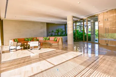 a living room with a couch and a table and chairs at Apartamento vista al Mar lateral Panoramic View,Spectacular building,Pools, Beach Morros zoe ultimo piso in Cartagena de Indias