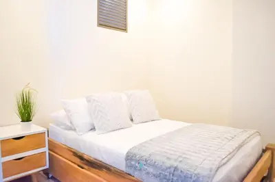 a bed with white sheets and pillows on it at Apartamento vista al Mar lateral Panoramic View,Spectacular building,Pools, Beach Morros zoe ultimo piso in Cartagena de Indias