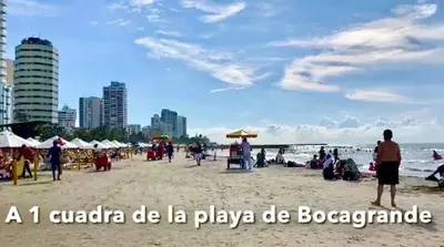a crowd of people on a beach with the words a canada be la at Apartamento 1804 Cartagena Bocagrande hermosa vista a 1 cuadra de la playa in Cartagena de Indias