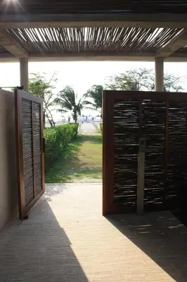 an open door to a building with a gate at Apartaestudio acceso al mar in Cartagena de Indias