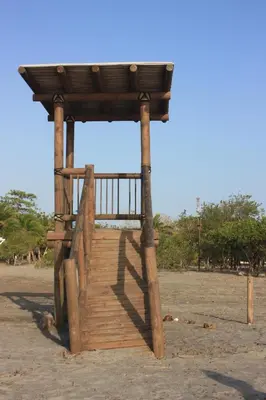 a wooden structure sitting in the middle of a field at Apartaestudio acceso al mar in Cartagena de Indias
