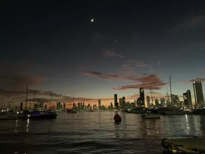 a city skyline with boats in the water at night at Cozy apt. on Manga Bay Blvd. (Apto. Bahia manga) in Cartagena de Indias