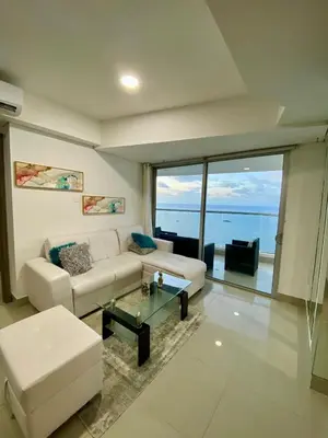a living room with a couch and a table at TU VISTA IDEAL in Cartagena de Indias