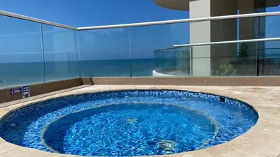 a large blue swimming pool in a building at TU VISTA IDEAL in Cartagena de Indias