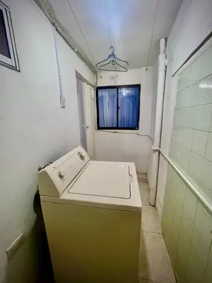 a washing machine in a bathroom with a window at Apartamento encanto in Cartagena de Indias