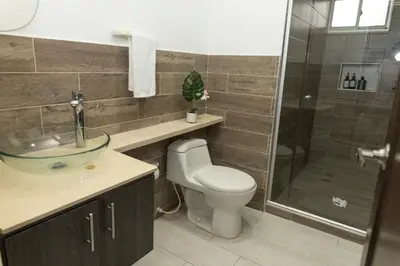 a bathroom with a toilet and a sink and a shower at Apartamento en Cartagena cerca al aeropuerto y Playa in Cartagena de Indias