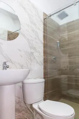 a bathroom with a toilet and a sink and a shower at Markasa Hotel boutique in Cartagena de Indias