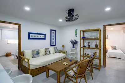 a living room with a couch and a table at Apartamento con salida a la playa in Santa Marta
