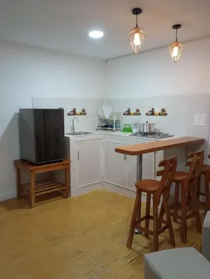 a kitchen with a table and chairs and a television at Hospedaje Casa Pachi en Cartagena de Indias in Cartagena de Indias
