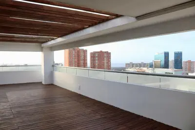 an empty apartment balcony with a view of the city at Atlantis Suites BAQ -Apartamento Moderno-2-BD in Barranquilla
