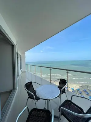 a balcony with a table and chairs and the ocean at Apartamento con vista al mar in Cartagena de Indias