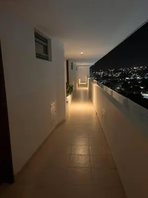 a hallway with a view of a city at night at Apartamento con vista al mar in Cartagena de Indias