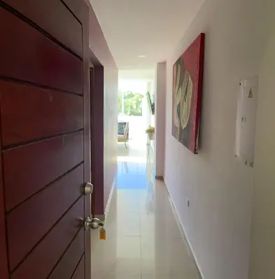 a hallway with a brown door and a hallway with at Apartamento 201 in Cartagena de Indias