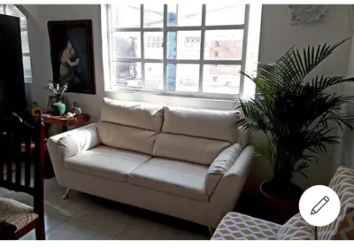 a white couch in a living room with a window at Alojamiento San Felipe in Cartagena de Indias