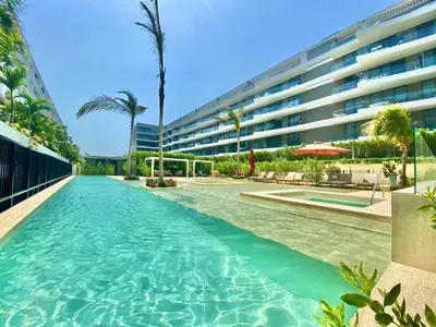 a swimming pool in front of a building at Espectacular frente al Mar- Morros Zoe - Playa Manzanillo Cartagena in Cartagena de Indias