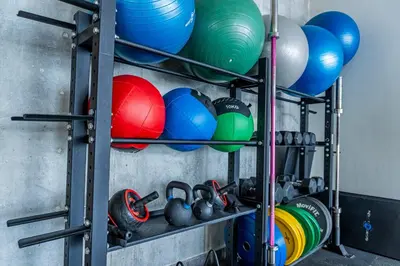 a shelf with dumbbells and other equipment on it at Apartamento en Bocagrande Cartagena in Cartagena de Indias