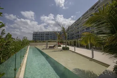 a swimming pool in front of a large building at Wynwood Morros Eco in Cartagena in Cartagena de Indias