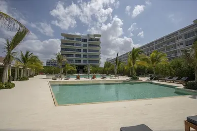 a swimming pool in front of a large building at Wynwood Morros Eco in Cartagena in Cartagena de Indias