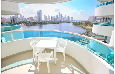 a table and chairs on the balcony of a cruise ship at torres del lago apartamento in Cartagena de Indias