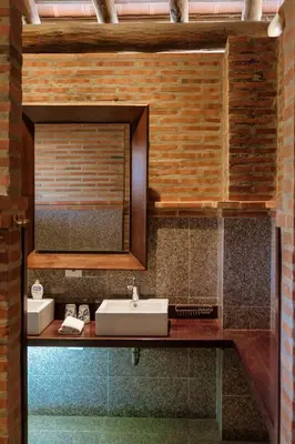 a bathroom with a sink and a mirror at Castillete Hotel & Beach Club in Tierra Bomba