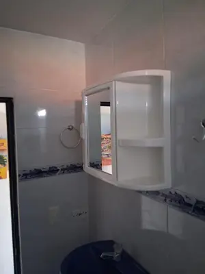 a bathroom with a white cabinet and a sink at Apartamento turistico Mariangel in Cartagena de Indias