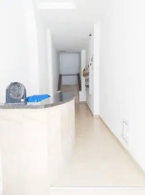 a white kitchen with a counter in a room at Apartamento centro histórico 303-2 in Cartagena de Indias