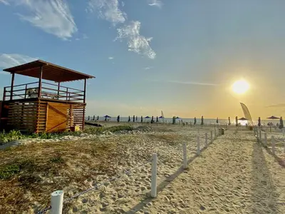 a beach with a lifeguard tower on the beach at Fantastic Loft/Beachfront+Pools in Cartagena de Indias