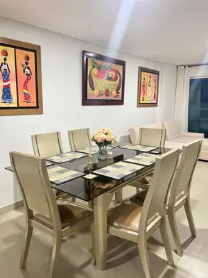 a dining room with a table and chairs at Torres del lago de 2 habitaciones, 1201 in Cartagena de Indias