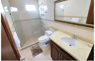 a bathroom with a toilet and a sink and a shower at Torres del lago de 2 habitaciones, 1201 in Cartagena de Indias