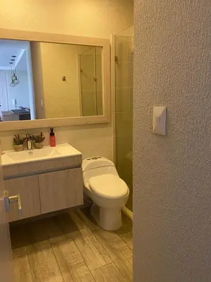 a bathroom with a toilet and a sink and a mirror at Dominique Cartagena, Beautiful 2 Bedroom Apartment in Cartagena de Indias