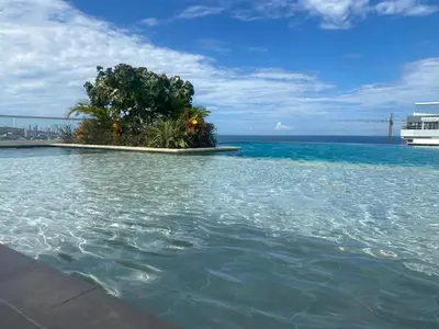 a small island in the water with a cruise ship at Dominique Cartagena, Beautiful 2 Bedroom Apartment in Cartagena de Indias