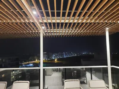a balcony with chairs and a view of the city at Dominique Cartagena, Beautiful 2 Bedroom Apartment in Cartagena de Indias