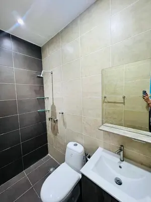 a bathroom with a toilet and a sink and a mirror at AzulRest Casa de Verano in Santa Veronica