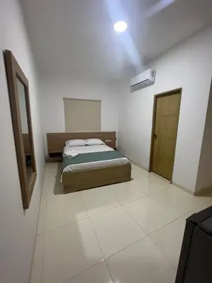 a bedroom with a bed and a mirror in it at Hotel Mariscales Sincelejo in Sincelejo