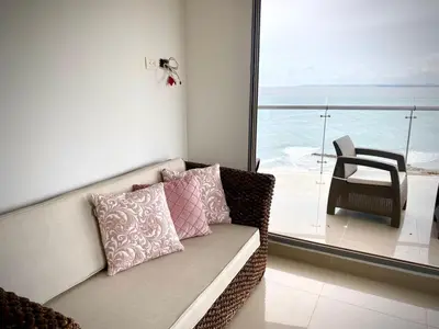 a couch in a room with a view of the ocean at Apartamento con espectacular vista al oceano in Cartagena de Indias