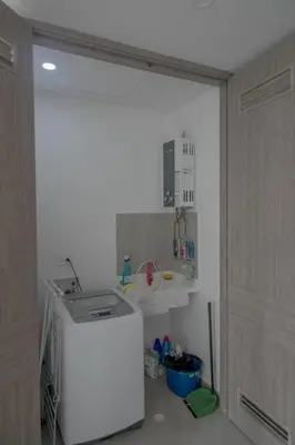 a kitchen with a white refrigerator and a sink at Great apartment in Bocagrande with sunset & beach view in Cartagena de Indias
